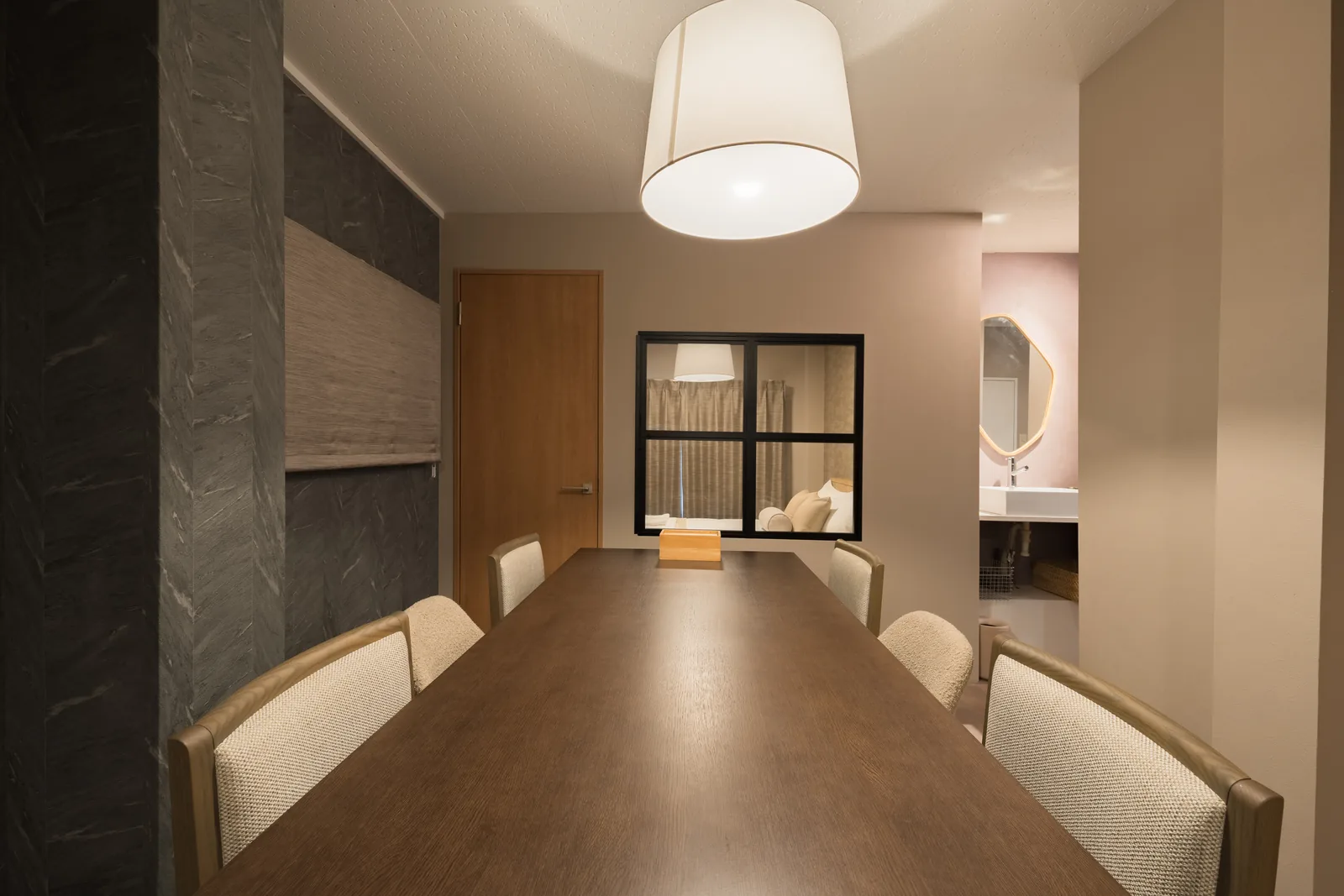 The long dining table in 101, set for a family