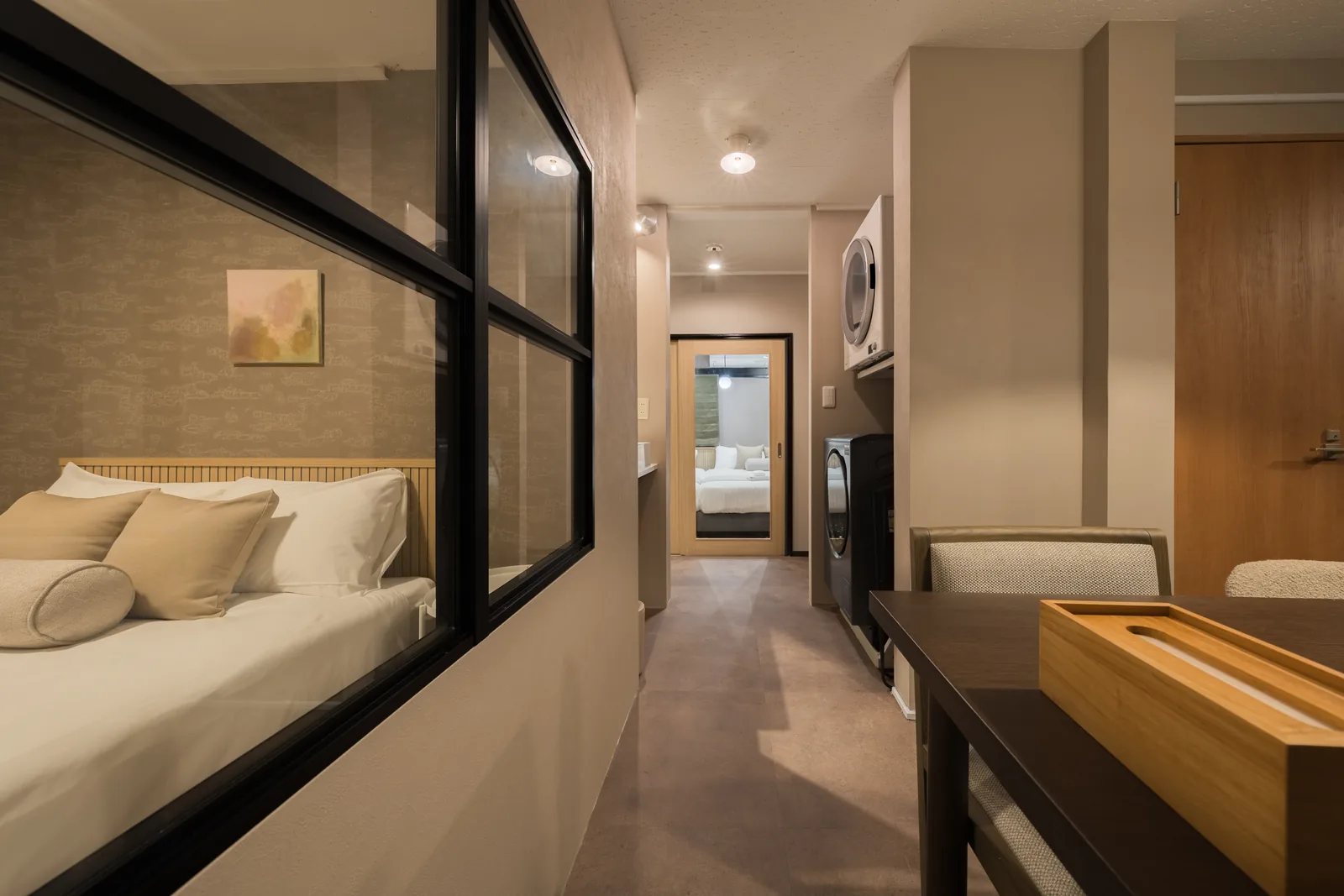 From the 101 bedroom, through the steel-framed window to the dining room